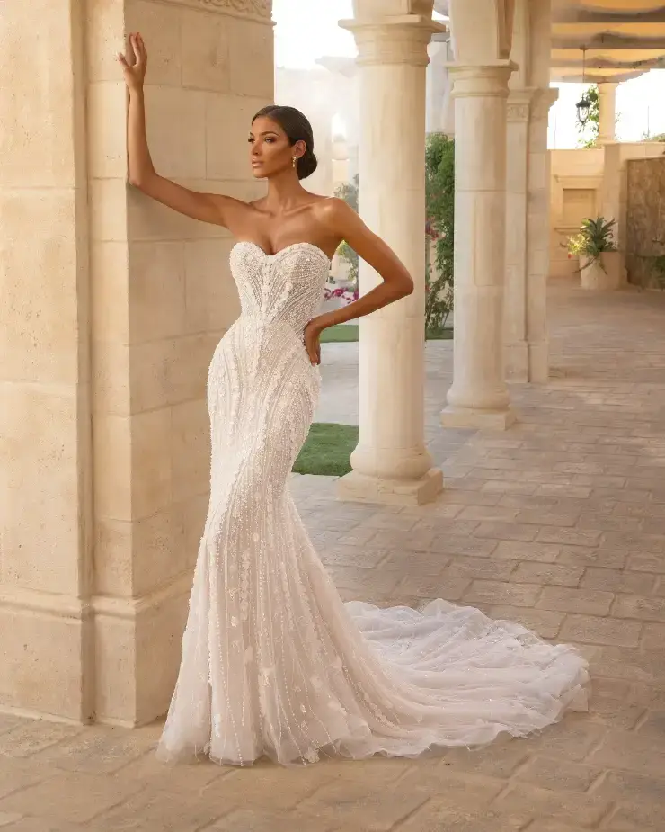 model is wearing a strapless fitted bridal gown