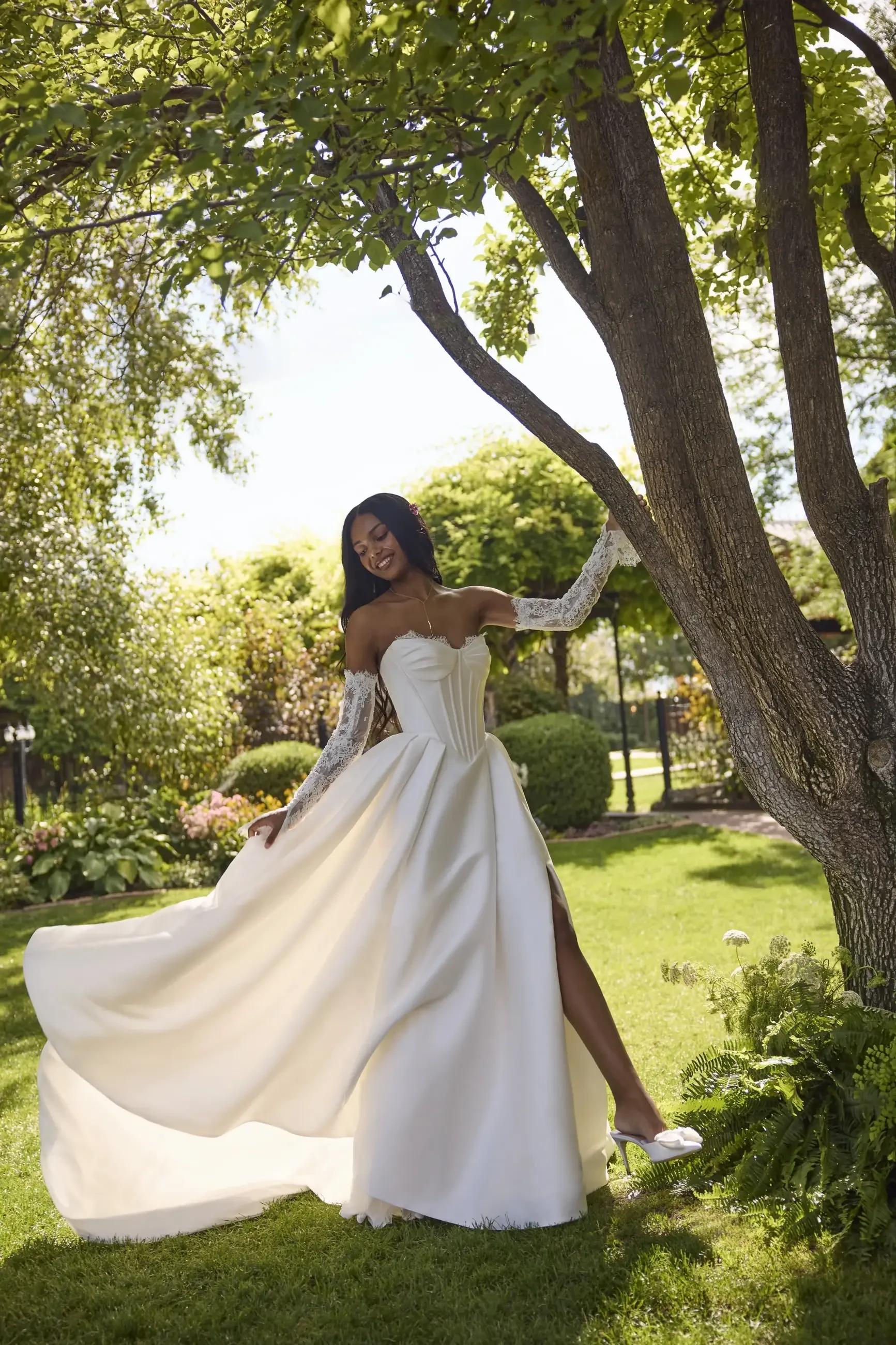 model is wearing a strapless ball gown